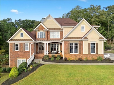 Craftsman house featuring brick siding and a front