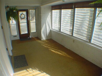 Reverse shot of front porch shows doorway to front