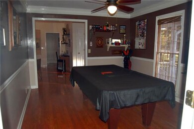 Large dining room currently being used for billiards.