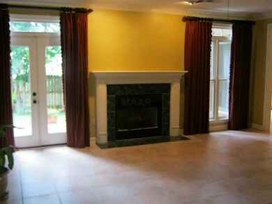 large great room opens into the backyard
