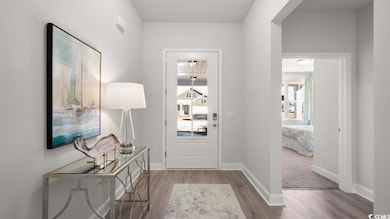 Doorway to outside featuring wood finished floors,