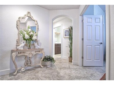 majestic foyer entry from front door, note the exquisite tile throughout the home