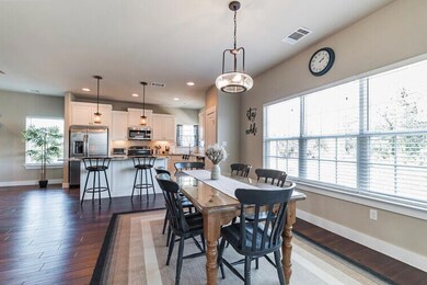 Dining room featuring baseboards, dark wood-style
