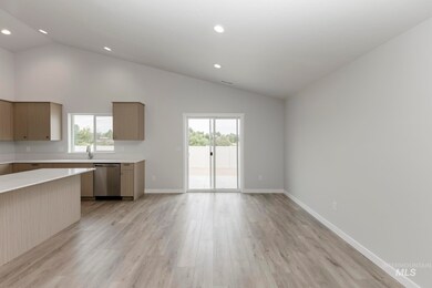 Kitchen featuring modern cabinets, plenty of natural light, light wood-style flooring, dishwasher, and recessed lighting
