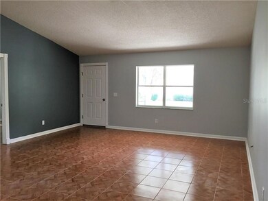 Your spacious living/dining room has soaring cathedral ceilings.