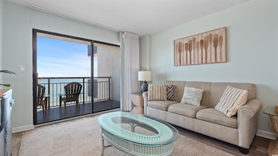 Living room featuring wood finished floors and a water view