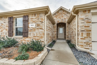 Property entrance with brick siding
