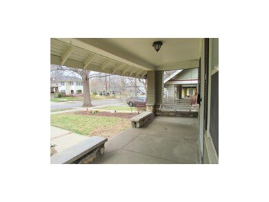 Inviting front porch with a swing.