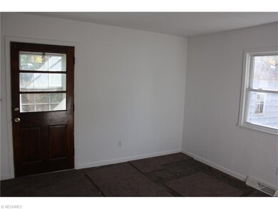 Family room. Door leads to driveway.