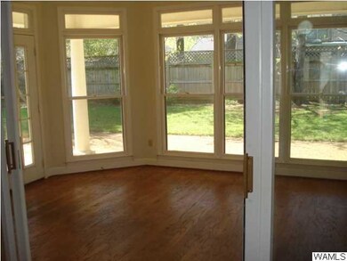 Sunroom off greatroom is also accessible from master bedroom and kitchen