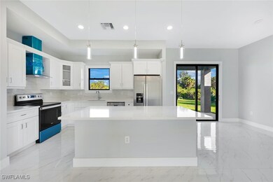 Kitchen featuring a center island, decorative ligh