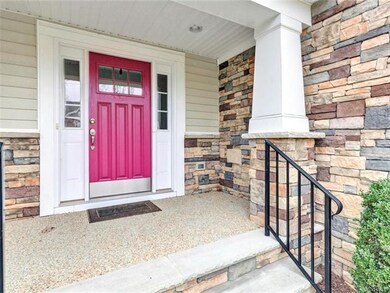 Stone steps and aggregate covered porch for ease o