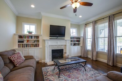 Bright & Light Family room w/ built in bookshelves & gas fireplace