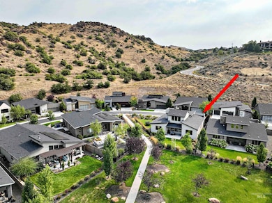 Aerial perspective of suburban area with a mountain backdrop