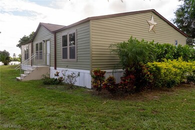 View of home's exterior featuring a lawn