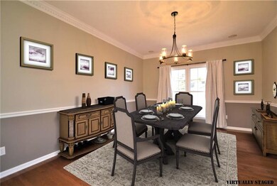 Updated dining room with plenty of room for large 