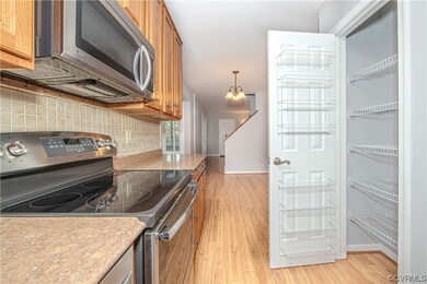 Kitchen with light wood-type flooring, appliances
