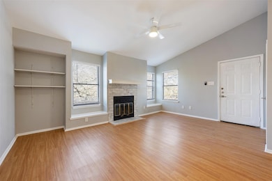 Unfurnished living room with a ceiling fan, lofte