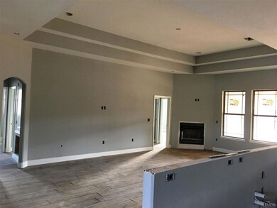 Living room has a wood burning fireplace.