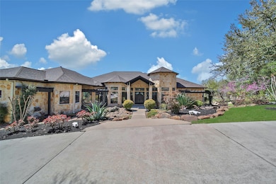 This stunning custom home features a modern stone