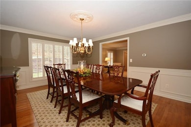 Large formal dining room with traditional moldings