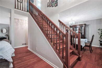 Front staircase has a formal dining room on the ri