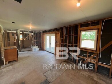 Misc room with french doors and a healthy amount of sunlight
