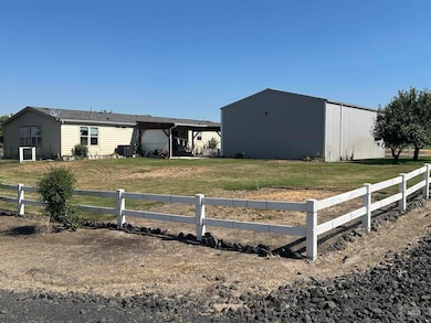 View of front facade featuring a pole building and an outbuilding