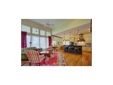 Grand great room with window of walls.  And check 