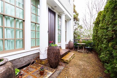 Private entry with seating area.