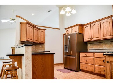 Kitchen has stainless steel appliances and a break
