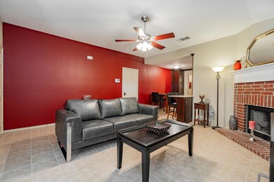 Living room with light tile patterned floors, a br