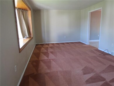 This large living room features a lovely bay windo