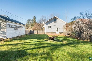 View of yard featuring a fire pit and a wooden dec