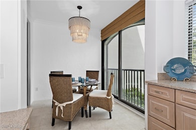 Dining room with light tile patterned floors, a ch