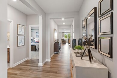 Make the best first impression with this bright and open foyer! (Photo of a decorated model, actual homes finishes will vary)