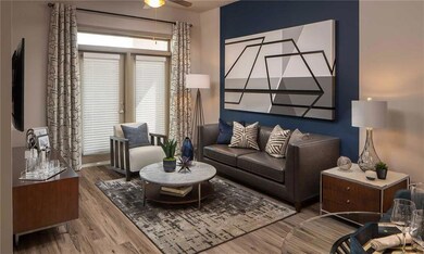 Living room featuring ceiling fan and hardwood / wood-style floors