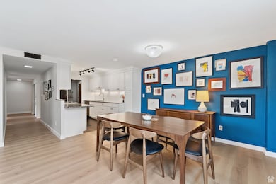 Dining room with light real hardwood floors.