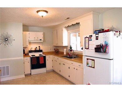 Large kitchen has eat-in area and two closets