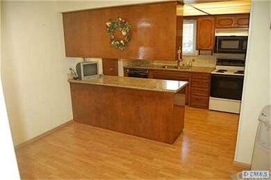Spacious Eat in Kitchen recently upgraded with newer granite counter tops and a stone tile backsplash!