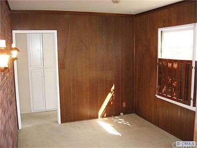 Wood paneling and brick room