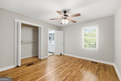 Primary bedroom with 2 closets & ensuite bathroom