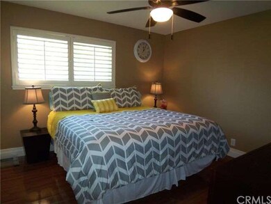 Master bedroom with beautiful wood laminate floori