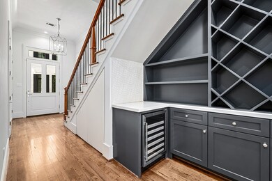 Upon entry, access to stairwell with wood flooring