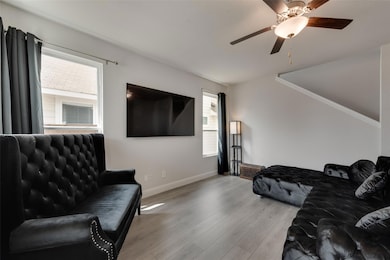 Living room featuring light wood-type flooring, a 