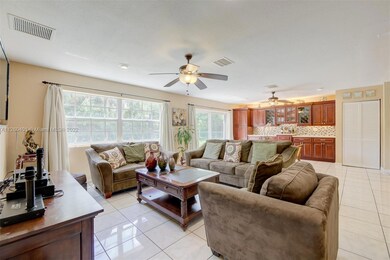 Large family room & den with custom bar and storage perfect for gatherings and game nights