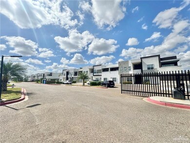 View of asphalt street with curbs, a residential view, and street lighting