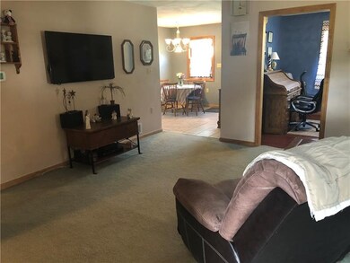 Family room with a view of the kitchen and the din