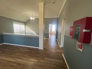Hall with vaulted ceiling, dark wood-type flooring
