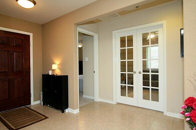 Enter this home on to tile flooring.  Home offers extended tile flooring through the entry, hallway, family room, baths and kitchen/breakfast areas!